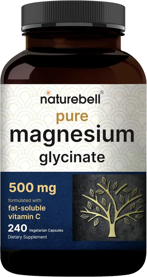 Hand holding two NatureBell magnesium glycinate capsules over a glass of water on a nightstand with a clock showing 9:30 p.m.